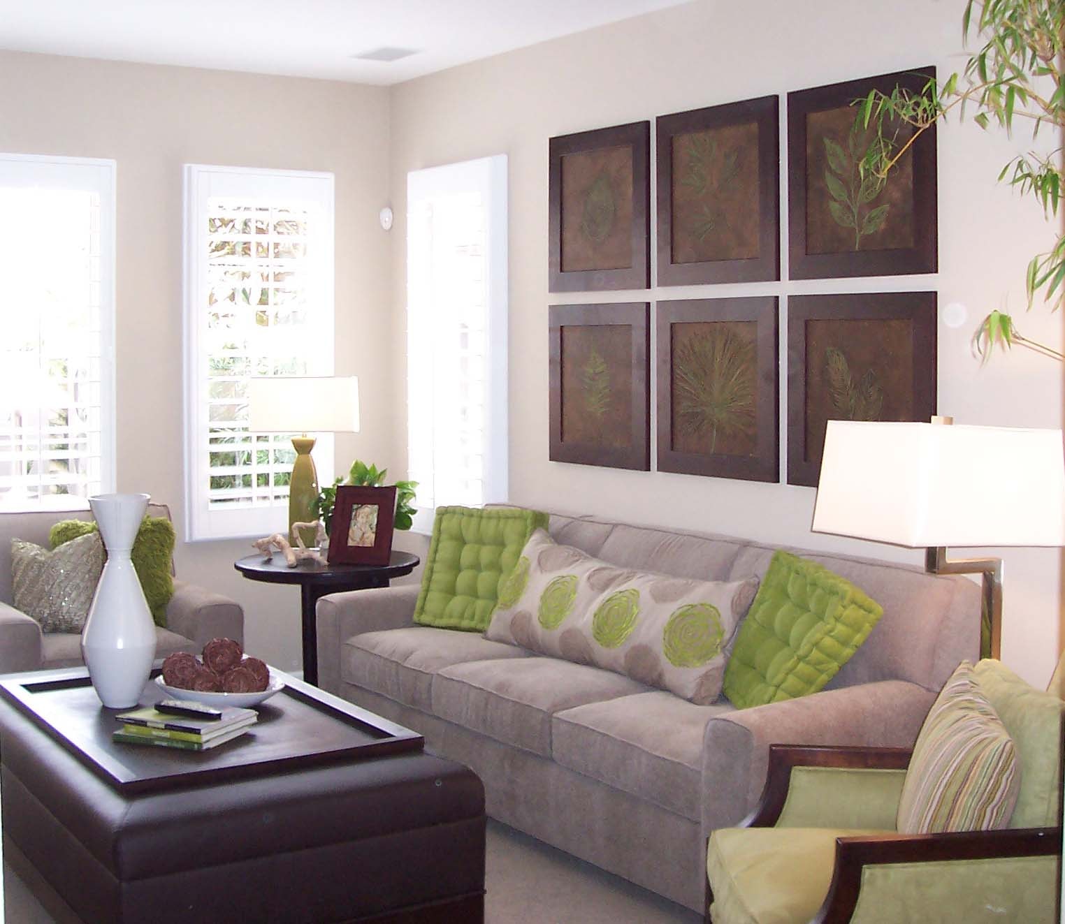 Living room with neutral palette, green accents and botanical wall art