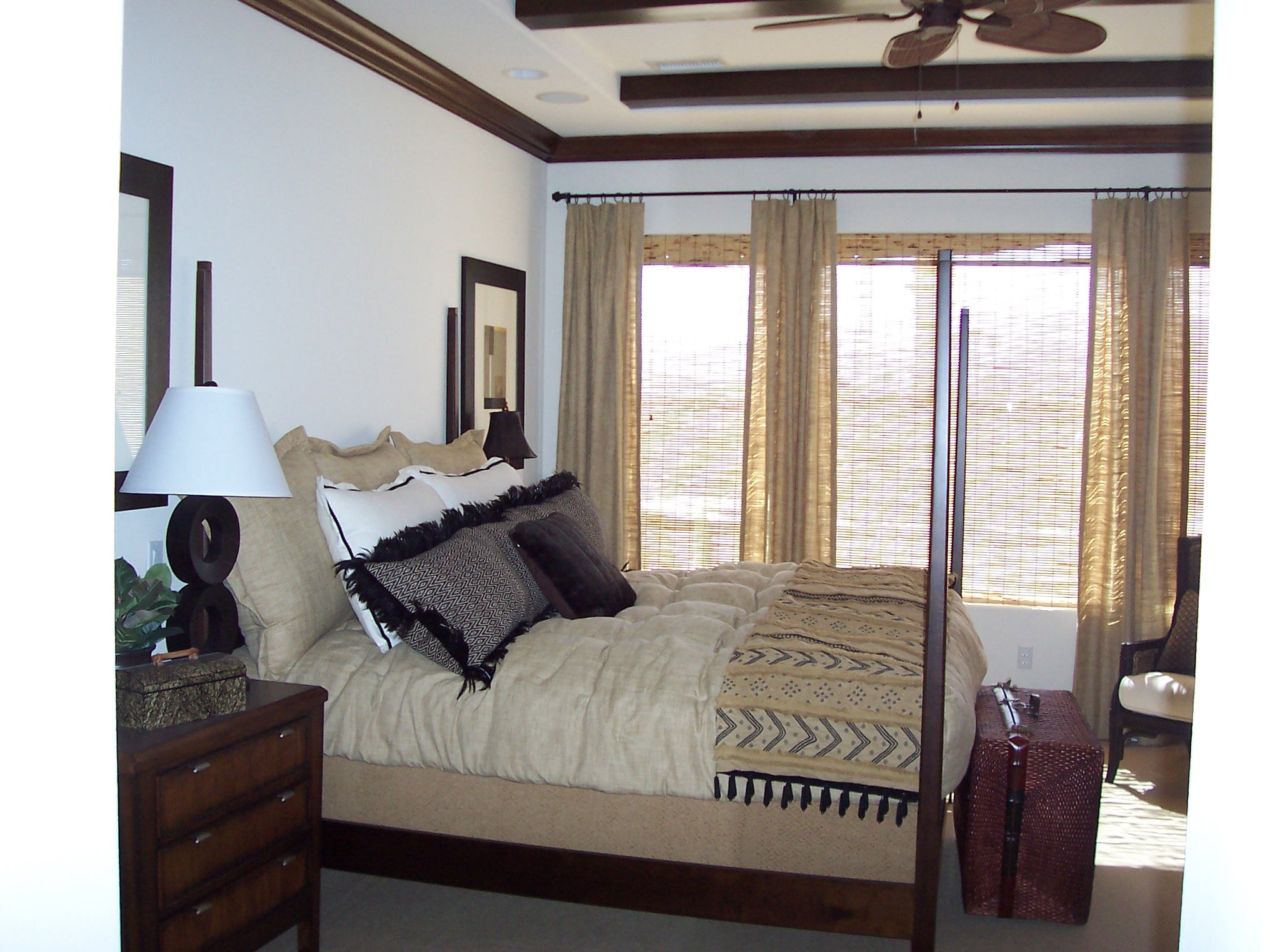 Four-poster bedroom with warm wood accents